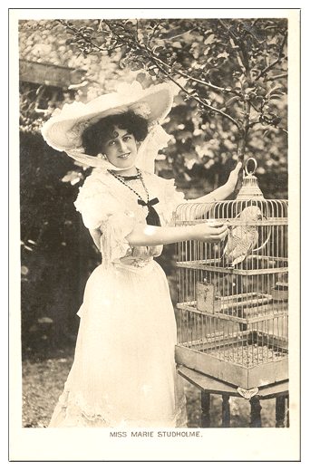 Miss Marie Studholme with her parrot